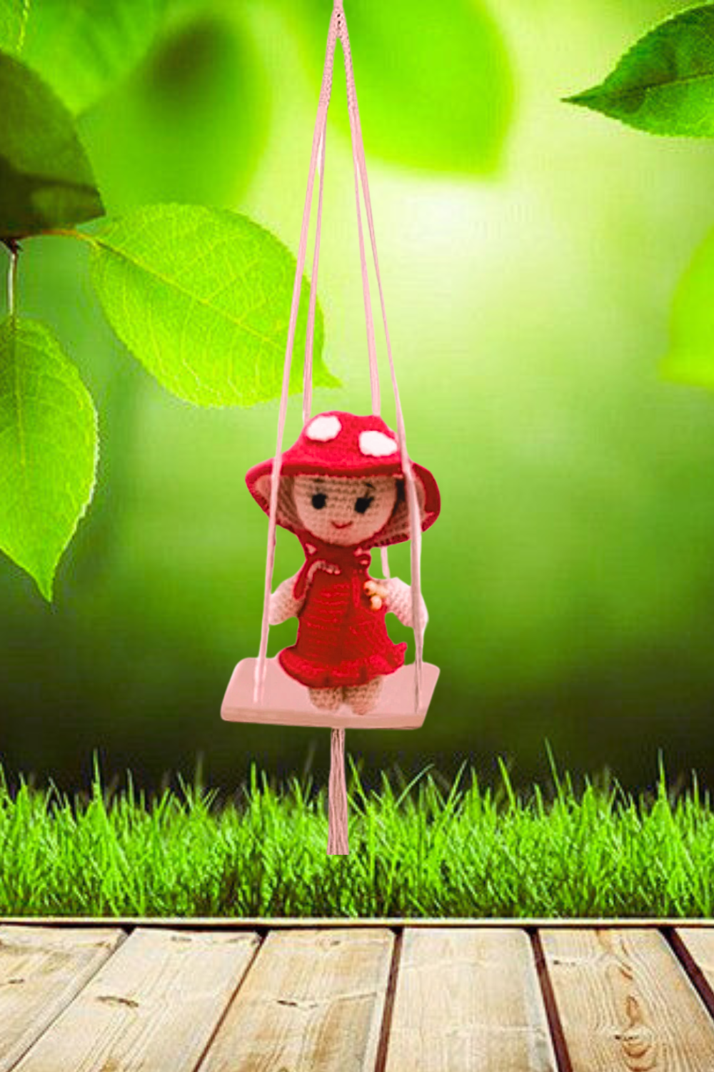 Mini crochet mushroom doll posed sitting on a wooden table or shelf