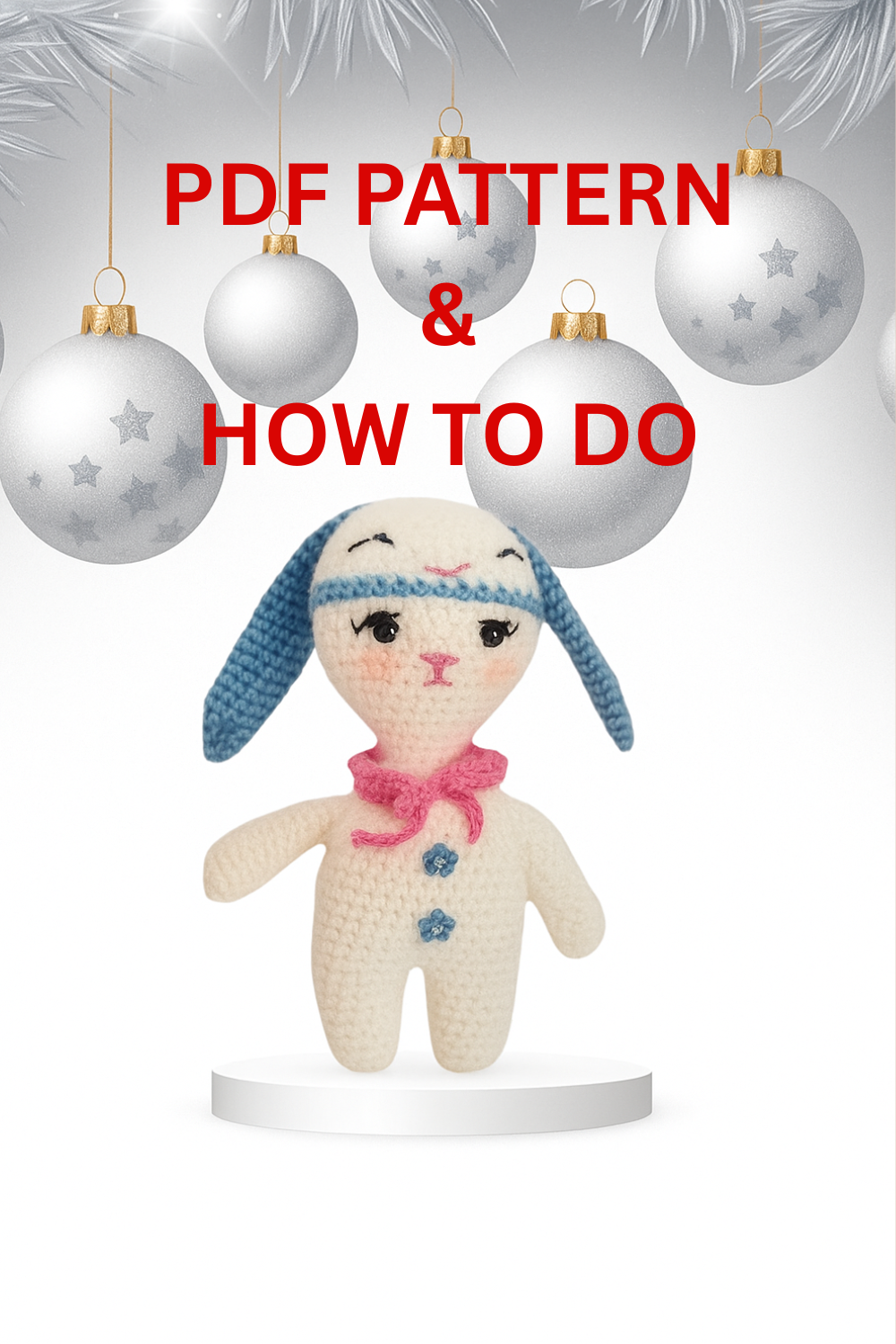 Hand holding a small crocheted white bunny ornament