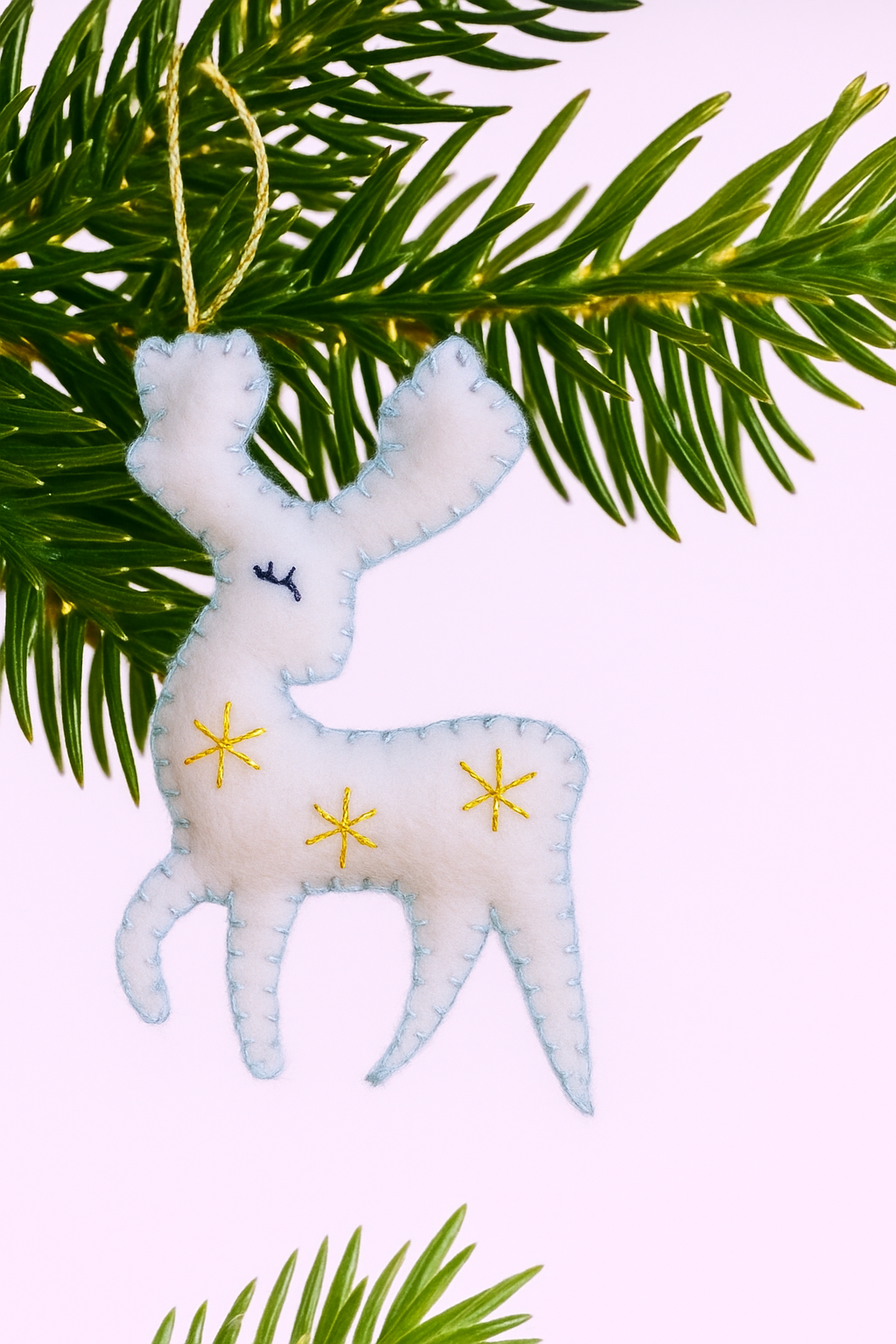 Adorable handmade felt reindeer with embroidered stars